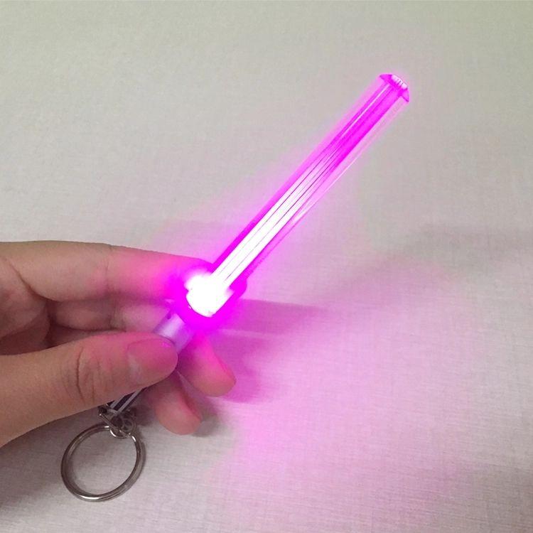 Saber Chops LIGHTSABER KEYCHAIN LIGHT UP LED STAR WARS Glowing Light Saber Key Chain -  8 COLOR MODES: Green, Blue, Red, Baby Blue, Pink, Yellow, White, Rainbow